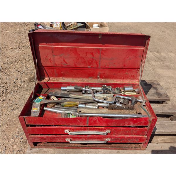 Red tool chest full of tools as pictured