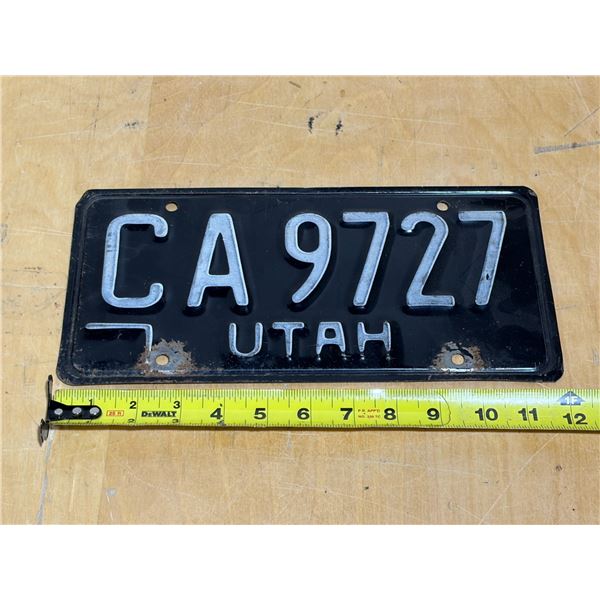 Vintage 1970s black Utah passenger license plate with the number CA 9727.