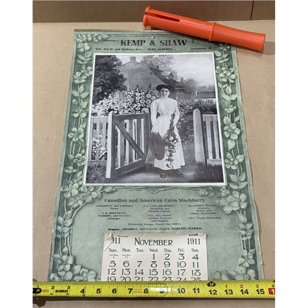 Vintage 1911 advertising calendar for Kemp & Shaw in Olds, Alberta, featuring a floral border around