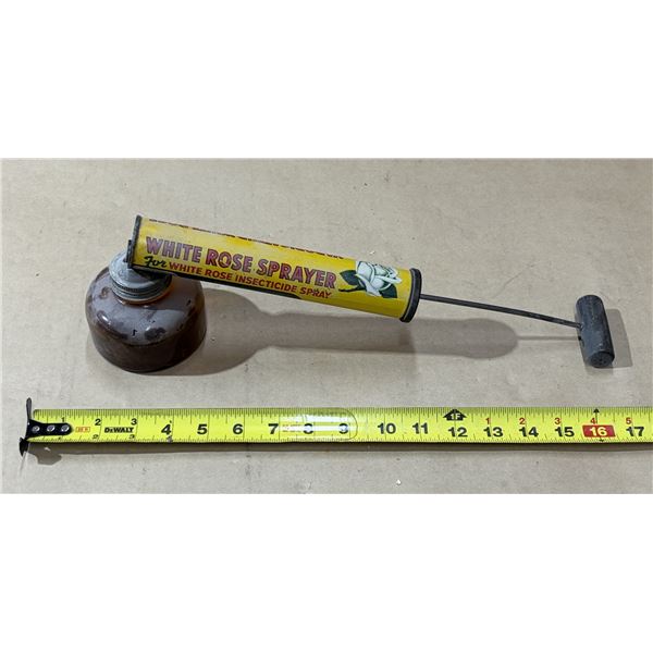 Vintage White Rose insecticide sprayer featuring a distinct yellow advertising label and a glass con