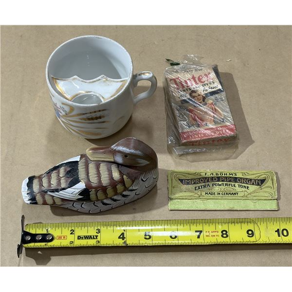 Tintex brand navy blue powdered fabric dye, wooden figurine duck, vintage porcelain cup and antique 