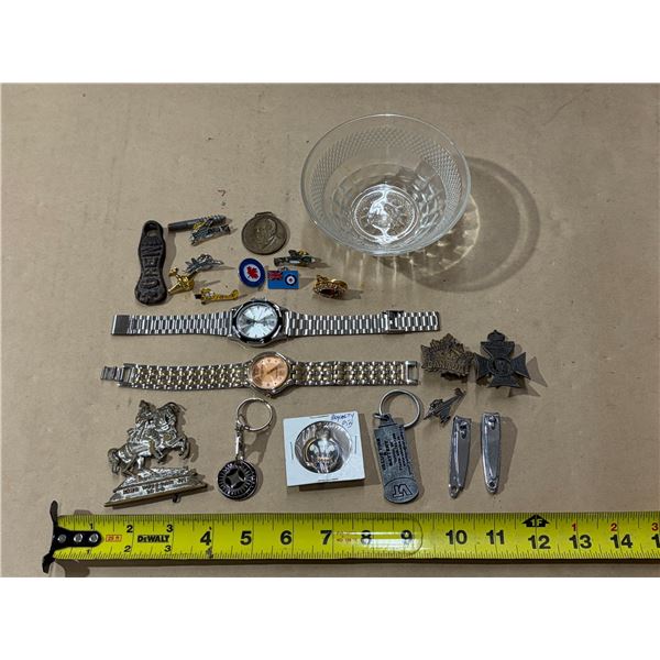 This collection consists of a varied assortment of personal items, including vintage watches, milita