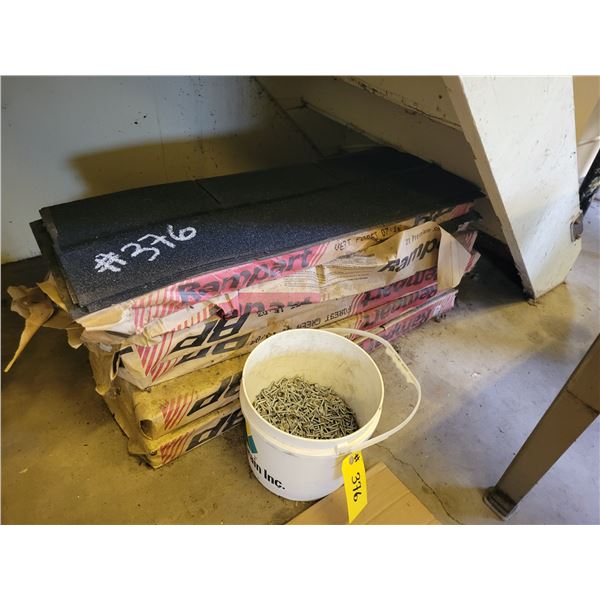 6 1/2- Bundles of black shingles c/w 1/2 bucket of staples