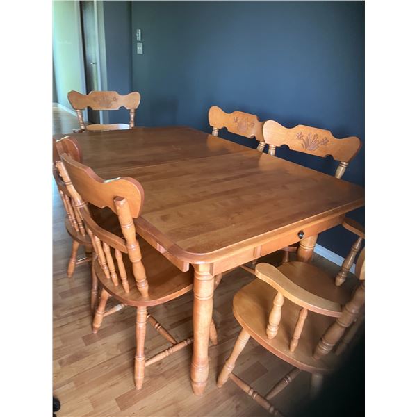 Solid maple kitchen table, approx. 39 in. x 58 in. c/w 6- chairs & 2- 10 in. leaves