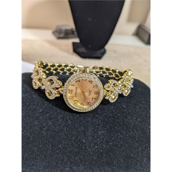 GOLD TONE W/ LOT OF RHINESTONE STRADA LADIES QUARTZ WATCH, BATTERY REQUIRED