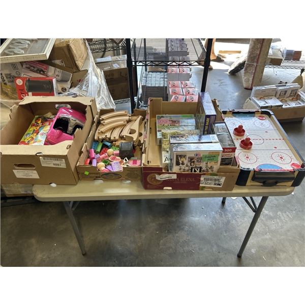 3 TRAYS OF KIDS GAMES, PUZZLES, TOYS, TRAIN TRACK AND SMALL AIR HOCKEY TABLE