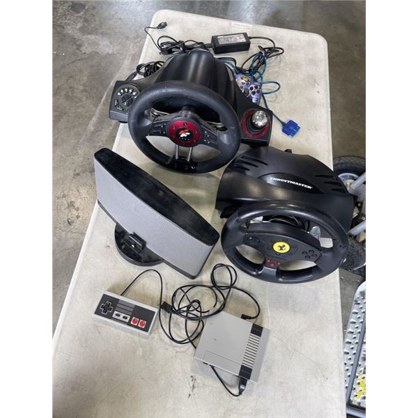 2 GAMING WHEEL SYSTEMS AND IPOD DOCK