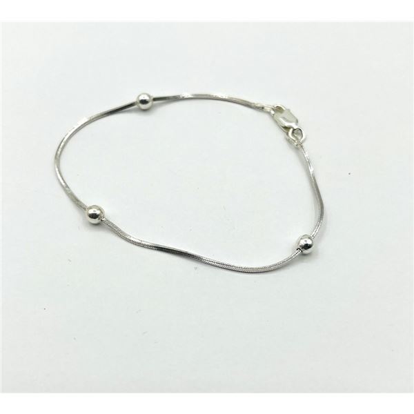 STERLING SILVER TRI BALL BRACELET 7', RETAIL $150.00.