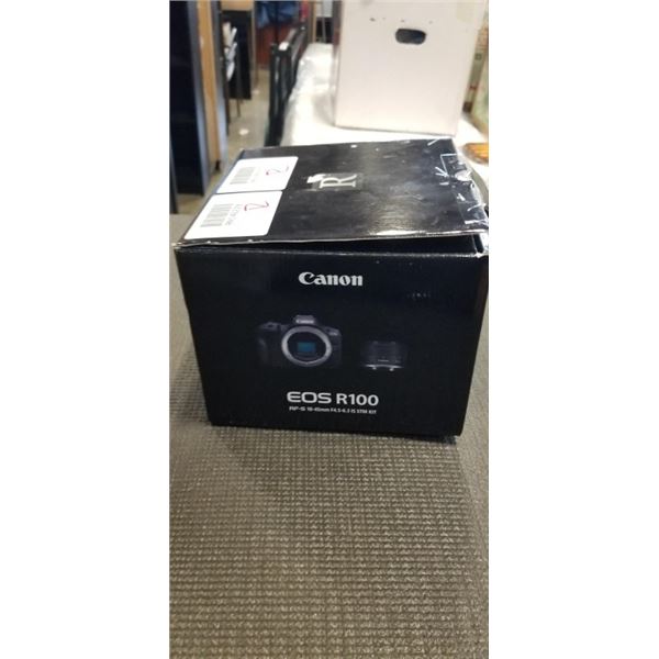 CANON EOS R100 RF-S 18-45MM CAMERA WITH BATTERY AND CHARGER (DOES SAY SET THE LENS TO THE SHOOTING P
