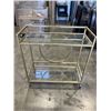 Image 1 : MODERN GOLD AND GLASS BAR CART