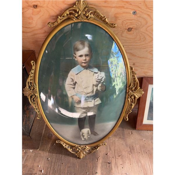 Oval Brass-Framed Child Portrait Photo
