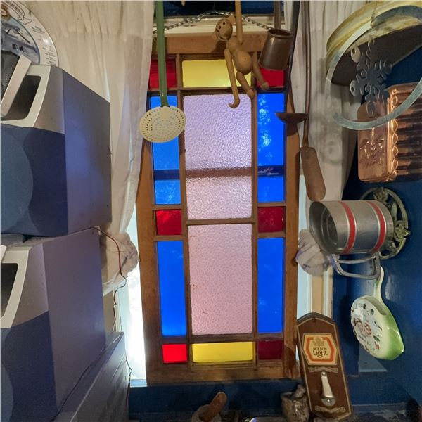 Vintage Stained Glass Window With Blue, Red, and Yellow Panels