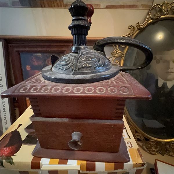 Antique Hand-Crank Coffee Grinder with Ornate Metal Top