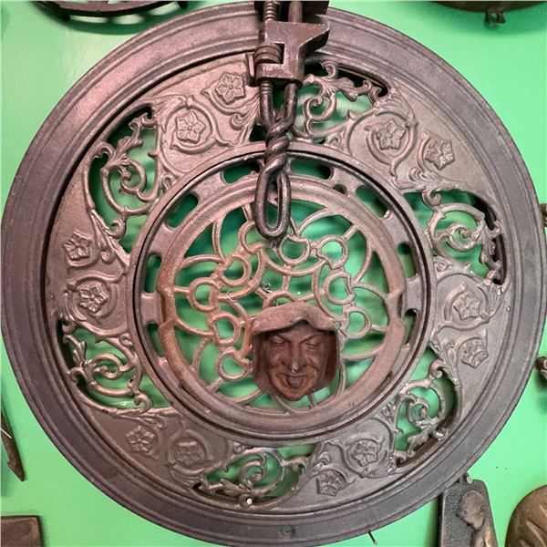 Antique Cast Iron Trivet With Ornate Face Motif