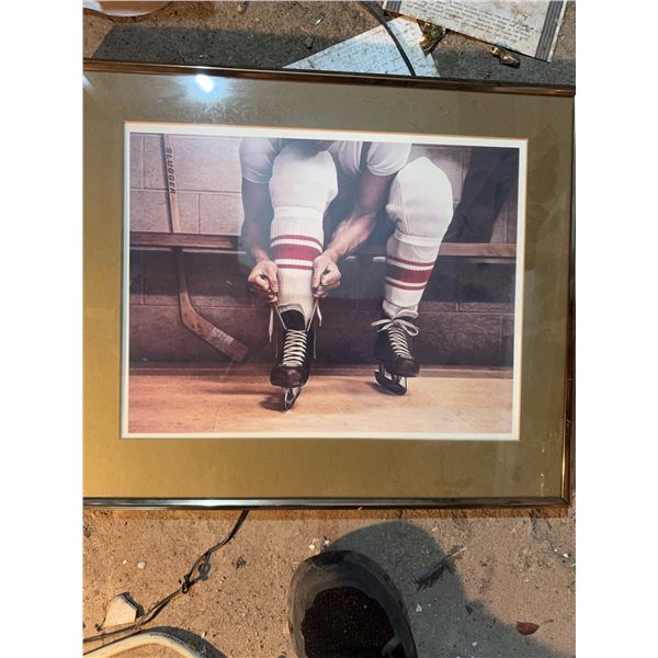 Framed Hockey Player Tying Skates Photograph