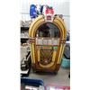 Image 1 : Wurlitzer 1080” Colonial" Jukebox, 1947, with Arched Glass Window and Starburst Speaker Grille