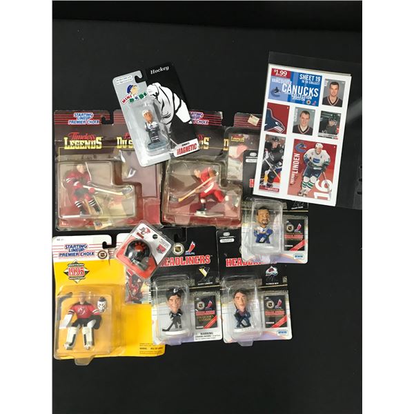 LOT OF VANCOUVER CANUCKS MEMORABILIA INCLUDING FIGURES AND STAMPS