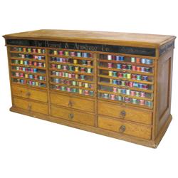 Brainerd & Armstrong Co. triple stack spool cabinet w/18 glass front doors, orig hardware & brass fi