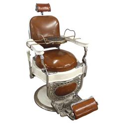 Barber chair, mfgd by Theo Koch-Chicago, white porcelain w/round seat, orig camel leather upholstery