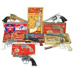 Toy cap guns in boxes (7), Hubley Smoking Tex Pistol, 2 Kilgore Broncos, Hubley Gold-Plated Texan Jr