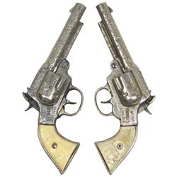 Roy Rogers & Trigger cap guns (2), variations on grips, cast metal w/Bakelite grips, both VG cond.