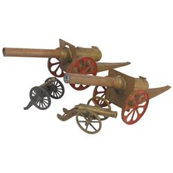 Toy cannons (4), all cast metal, larger 2 have cast iron wheels w/orig paint & are 24"L, all VG cond