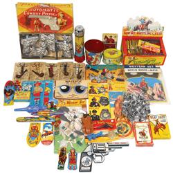 Dime store vintage toys, includes cowboy lasso & cowboy pistol display, Western saddle rings, badges