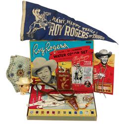 Roy Rogers items, includes leather wallet, cuffs, water color set, character mug, bolo tie on displa