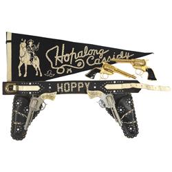 Hopalong Cassidy black leather double holster w/2 Wyandotte Hopalong Cassidy cap guns, 2 gold Hoppy 