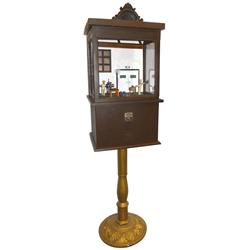 Coin-operated working model butcher shop, 5 cent, butcher cuts meat on block while another grinds me