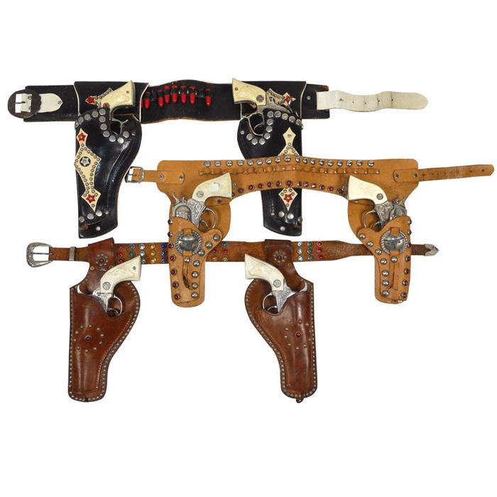 Toy cap gun & holster sets (3), 2 Hubley Texan guns w/double holster, 2