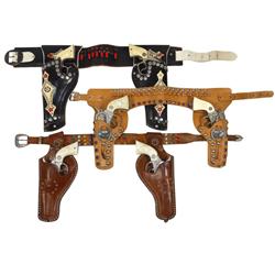 Toy cap gun & holster sets (3), 2 Hubley Texan guns w/double holster, 2 early version Pony Boys w/do