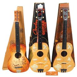 Toy guitars in boxes (3), Gene Autry by Emenee, No. 601, Cowboy guitar by Enenee & Rock'n Roll guita
