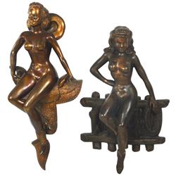 Nude cowgirls (2), both cast metal, girl on fence marked "Bar-Abbo", other on saddle, both w/orig su
