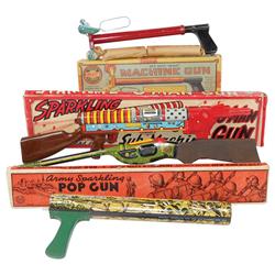 Toy machine guns (4), Army Sparkling pop gun in box by Marx, Sparkling G-Man sub machine gun in box 