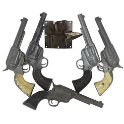 Hollywood Western movie prop lot, cast metal prop guns (5) & Warner Bros. mechanical arrow that pops