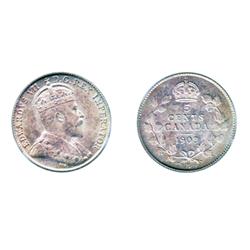 1903-H.  PCGS graded Mint State-64.  Light to medium heavy amber toning, with blue highlights.