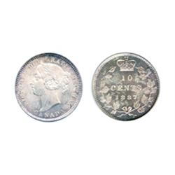 1887.  PCGS graded Mint State-64.  Outstanding luster.  Brilliant at the center, with rose-gold acce