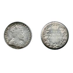 1903.  PCGS graded Mint State-63.  Medium heavy toning in shades of pale blue-amber with rainbow hig