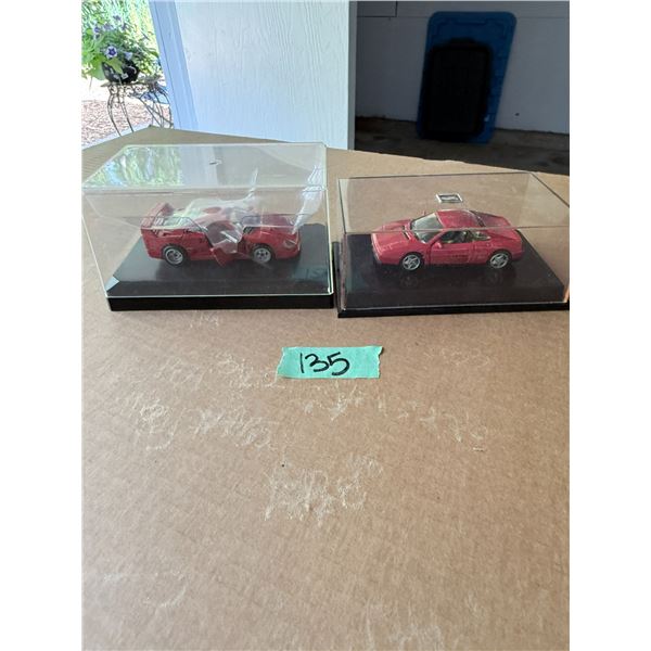 GROUP OF 2 RED DIECAST MODEL CARS IN DISPLAY CASES FERRARI