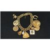 Image 1 : APPROX 10K CHARM BRACELET WITH ELEVEN APPROX 10K+ CHARMS (35.1G)
