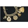 Image 2 : APPROX 10K CHARM BRACELET WITH ELEVEN APPROX 10K+ CHARMS (35.1G)