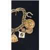 Image 3 : APPROX 10K CHARM BRACELET WITH ELEVEN APPROX 10K+ CHARMS (35.1G)