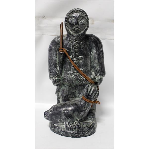A WOLF ORIGINAL SOAPSTONE CARVING SEAL HUNTER