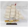 Image 1 : VINTAGE YELLOW-HULLED TRADITIONAL SAILING BOAT