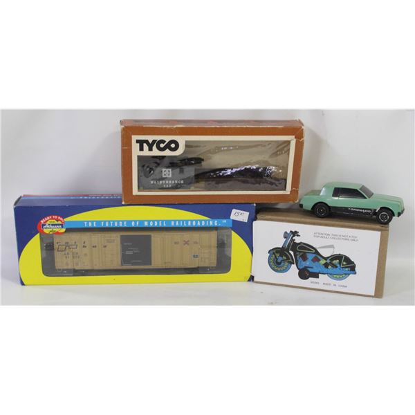 TWO MODEL TRAINS SOLD WITH MODEL MOTORCYCLE