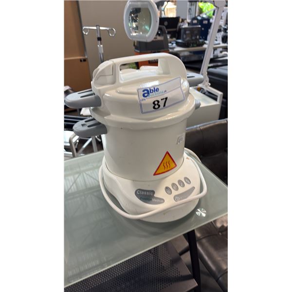 PORTABLE STEAM AUTOCLAVE STERILIZES CLINICAL TOOLS, DENTAL IMPLEMENTS, AND TATTOOING EQUIPMENT.
