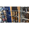 Image 3 : COMMERCIAL FACILITY LOT: WIDE MASSAGE TABLE, MEDICINE BALL RACK, KETTLEBELLS, OLYMPIC BARS GRIPS