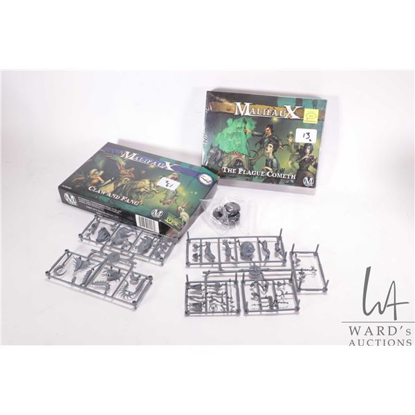 Boxed Malifaux Claw and Fang and sealed box Malifaux The Plague Cometh. Appears complete but not gua