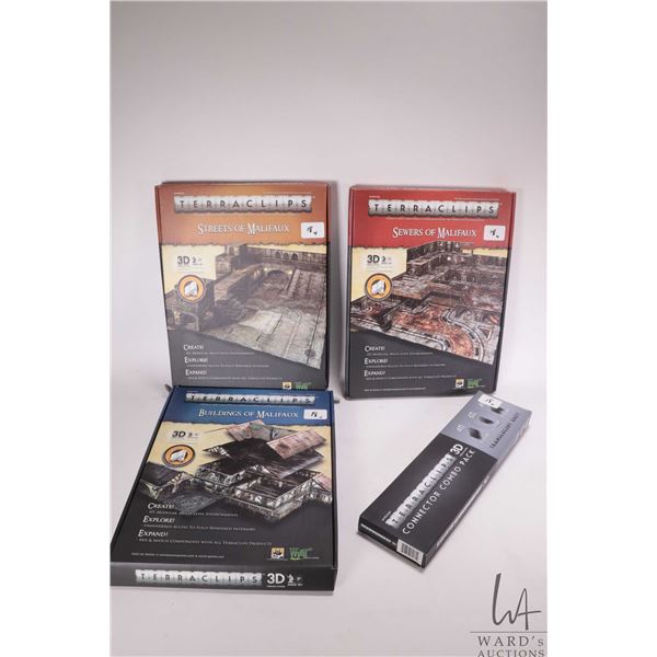 Three boxed sets for Malifaux including Bulidings of Malifaux, Sewers of Malifaux and Streets of Mal